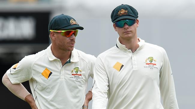 David Warner (left) speaks to Steve Smith on day 5 of the first Test match between Australia and Pakistan at the Gabba in Brisbane in 2016.