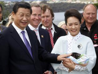 President Xi Jinping and Madame Peng Liyuan with one of the baby Tasmanian devils.