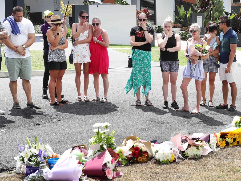 A large group of family and friends arrive at the scene of the car fire to pay respects to Hannah Clarke and her three children. Picture: Liam Kidston