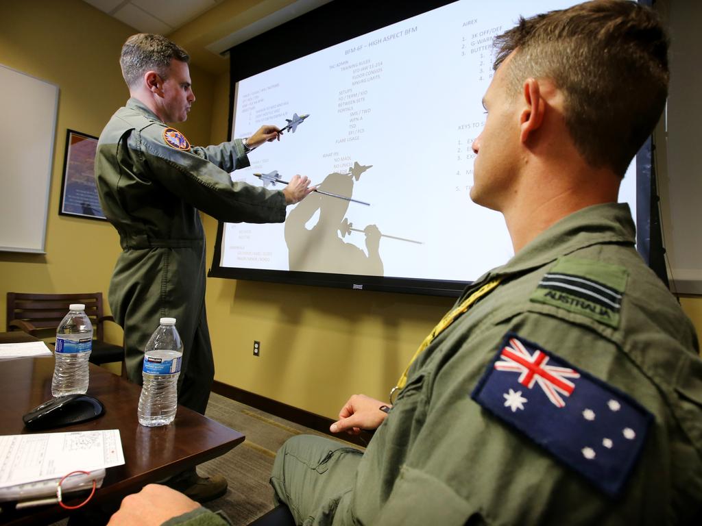 Australian Pilots training in the F35 fighter Jets Luke Airforce Base in Phoenix Arizona. Squadron leader Wing Commander Darren Clare (L) briefs Flight Lieutenant “Damo” before a flight . Picture: Nathan Edwards