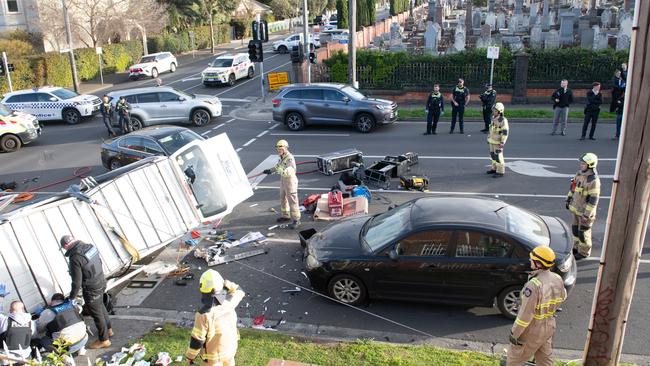 Police work to free the men trapped in the van after the crash. Picture: Supplied/ Chris Phutully