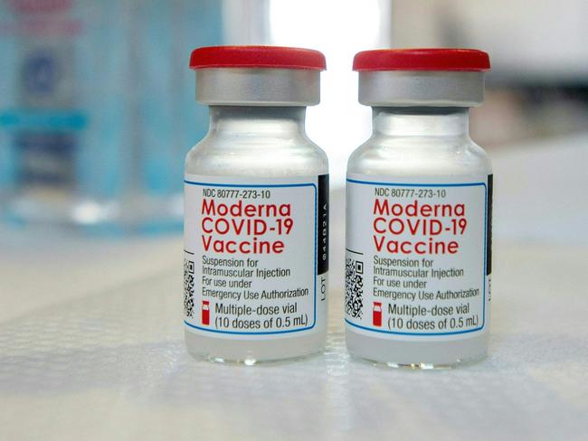 (FILES) In this file photo taken on April 20, 2021 Moderna vials sit on a table before they are loaded into syringes at a mobile Covid-19 vaccination clinic in Bridgeport, Connecticut. - Moderna on September 1, 2021 announced it had begun submitting an application to the US Food and Drug Administration to authorize a booster of its Covid vaccine after trial data showed a significant increase in antibodies against variants. (Photo by Joseph Prezioso / AFP)