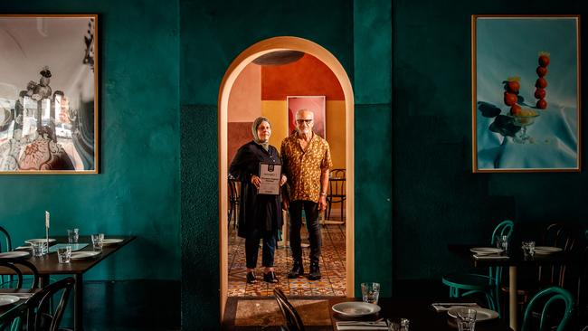 Zelmai and Farida Ayubi holding their delicious100 certificate at their Parwana restaurant in Torrensville. Picture: Matt Turner