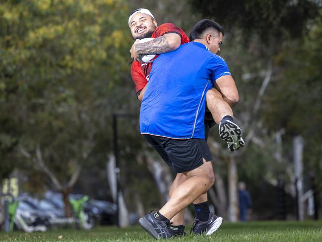 RUNIT competitor Phillip Poligerinos and RUNIT co-owner Rennie Molimau clash in a ‘run-it-straight’ challenge. Picture by Wayne Taylor