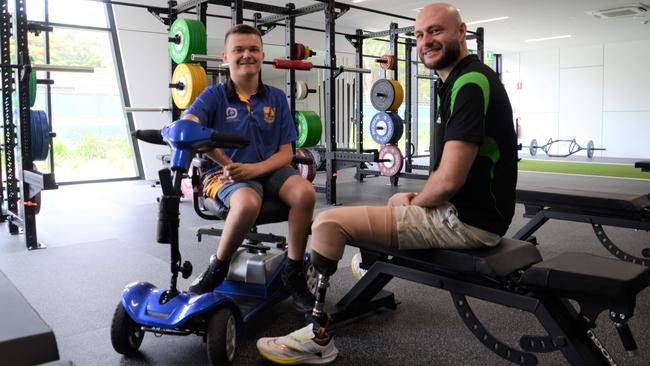 Townsville wheelchair basketball player Byron Holman, 19, with wheelchair rugby Paralympian Chris Bond at the Townsville Sports Precinct. Picture: Natasha Emeck