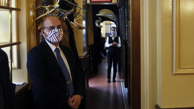 Waiters at Alain Ducasse's restaurant Allard wait for customers in Paris. Picture: AP