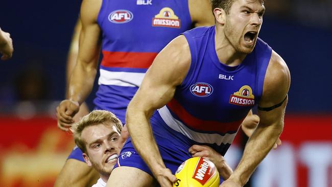 Stewart Crameri clears by hand for the Western Bulldogs during his AFL days. Picture: Michael Klein