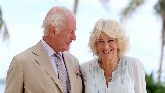 In this handout photograph released by Getty Images on October 27, 2024, Britain's King Charles III and Britain's Queen Camilla pose for a photograph during a visit to a beach in Apia, Samoa on October 25, 2024. (Photo by Chris Jackson / CHRIS JACKSON COLLECTION / AFP) / RESTRICTED TO EDITORIAL USE - MANDATORY CREDIT "AFP PHOTO / CHRIS JACKSON / GETTY IMAGES " - NO MARKETING - NO ADVERTISING CAMPAIGNS - NO DIGITAL ALTERATION ALLOWED  - DISTRIBUTED AS A SERVICE TO CLIENTS - NO ARCHIVE - NOT TO BE USED AFTER NOVEMBER 8, 2024 /