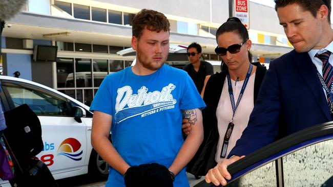 Police officers arrive on the Gold Coast from Melbourne with 25-year-old Strauch. Photo: David Clark