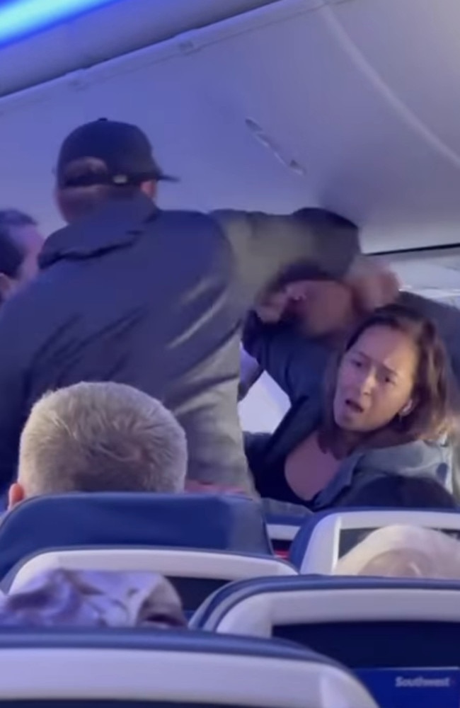 A video captured two men in a fist fight mid-flight on the way to Hawaii. Picture: @kauai.airbnb via Storyful