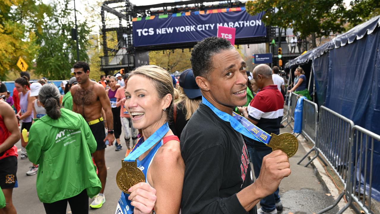 Amy Robach and TJ Holmes run during the 2022 TCS New York City Marathon on November 06, 2022 in New York City. (Photo by Bryan Bedder/New York Road Runners via Getty Images)