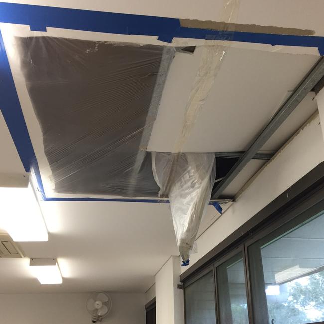 A ceil that has fallen in was hastily covered in plastic sheeting at Narrabeen Sports High School to stop rain leaking into a classroom. Picture: Supplied