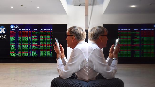 A huge chunk of the cost of the large corporate tax reduction will be borne by long-term investors because it substantially reduces the value of their franking credits. (AAP Image/Mick Tsikas)