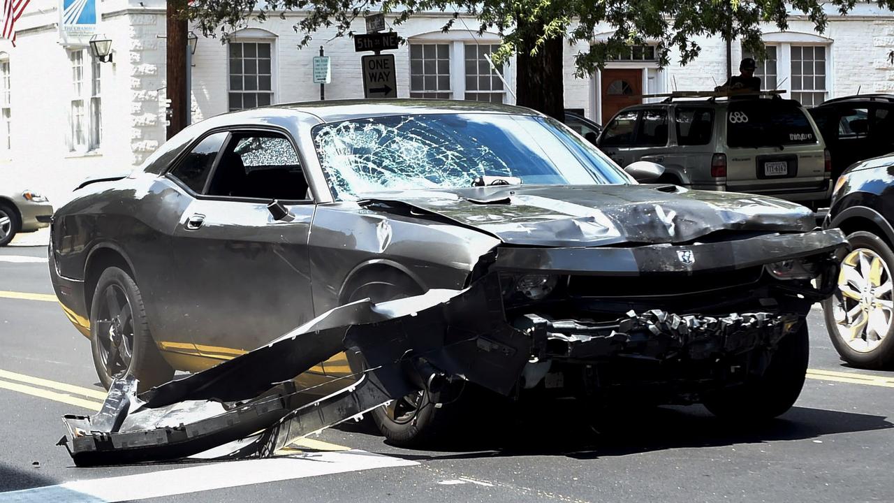 The silver Dodge Charger allegedly driven by James Alex Fields Jr. passes near the Market Street Parking Garage moments after driving into a crowd of counter-protesters on Water Street in Charlottesville, Virginia. Picture: Matthew Hatcher/Getty Images North America/AFP