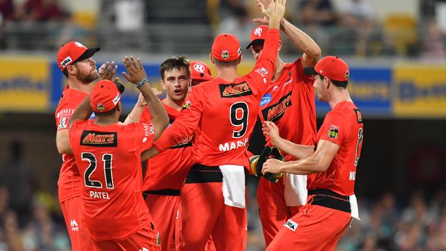 Cameron Boyce (centre) celebrates with teammates after getting the wicket of Matthew Renshaw. Picture: AAP