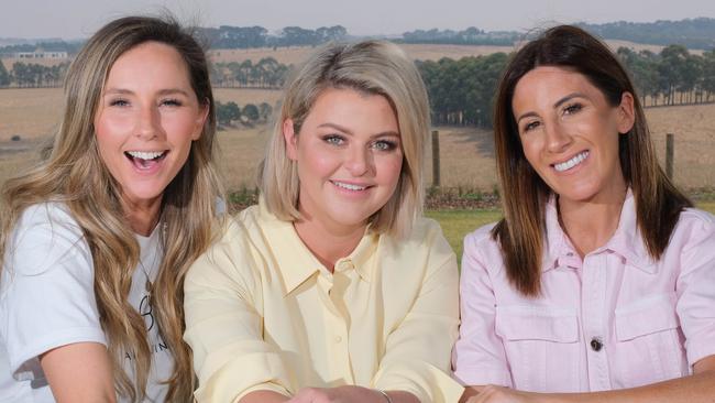 Emma Hawkins (centre), pictured with Renee Enright and Lana Wilkinson, has praised the AFL for persevering with the 2020 season. Picture: Mark Wilson