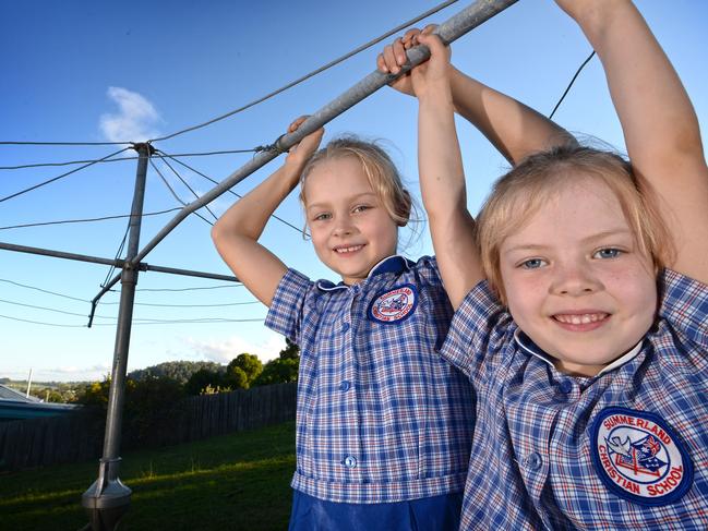 Meredith, 7, and Jocelyn, 5, Onus, of East Lismore, become a new generation introduced to the wonders of the Hills Hoist.