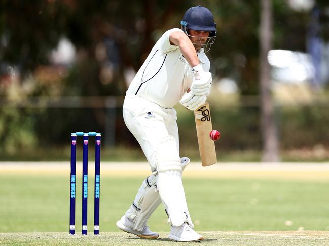 Josh Holden of Buckley Ridges lays bat on the bright new ball. (Photo by Josh Chadwick)