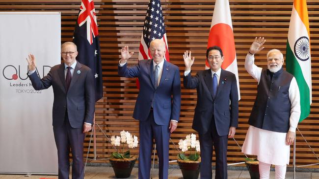 Australian Prime Minister Anthony Albanese, US President Joe Biden, Japanese Prime Minister Fumio Kishida and Indian Prime Minister Narendra Modi wave to the media prior to the Quad meeting in Tokyo on May 24. Picture: AFP