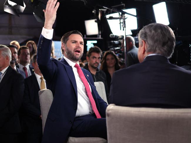 J.D. Vance gestures as he speaks to a Fox News reporter in the spin room after participating in the debate. Picture: AFP