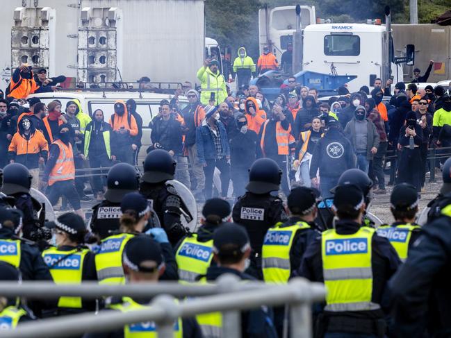 Police face off with West Gate Bridge blocking CFMEU protesters. Picture: David Geraghty