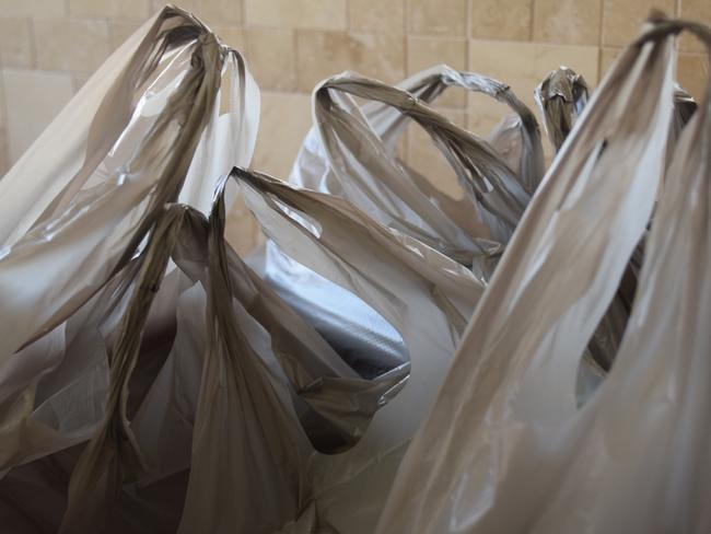 Coles and Woolworths will already save $170 million by not giving away free plastic bags. Picture: iStock