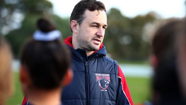 Darebin coach Mitch Skelly talks to his players.