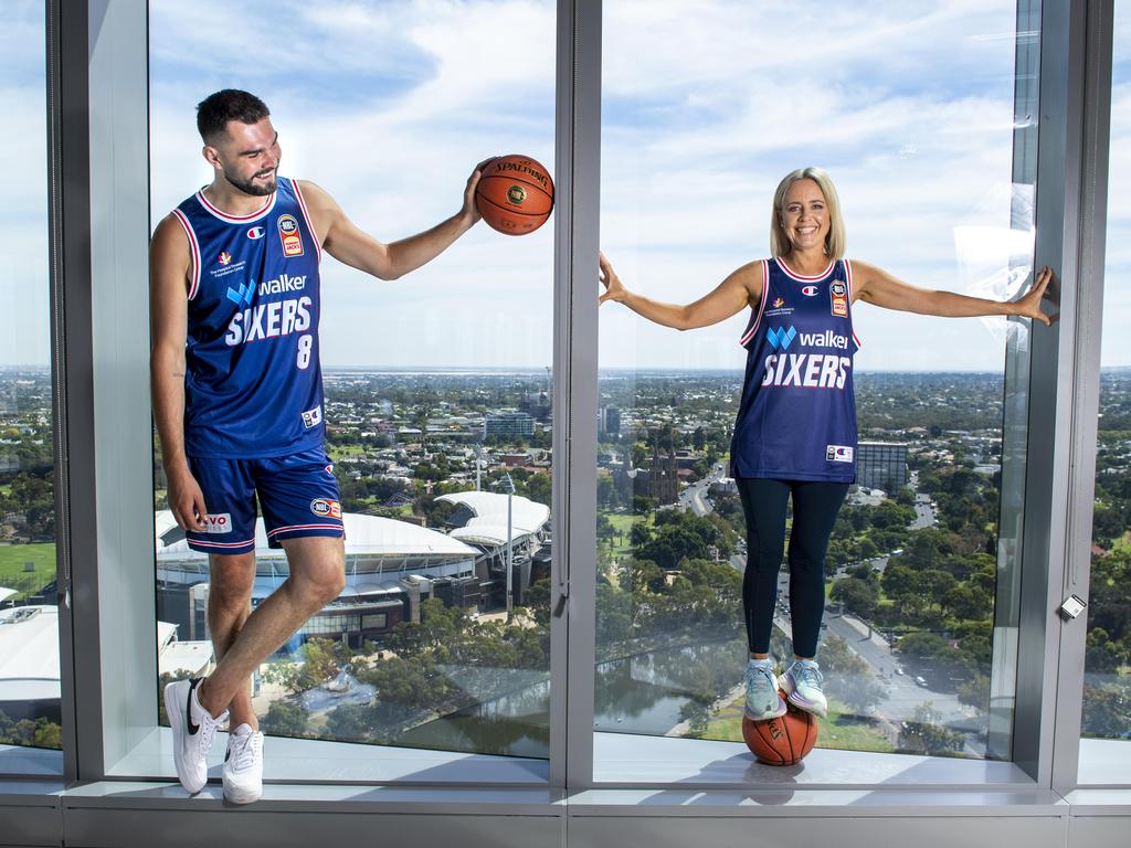 Adelaide star Isaac Humphries, who has re-signed for three years with the 36ers, and Walker Corporation ambassador Jessica Adamson. Picture Mark Brake