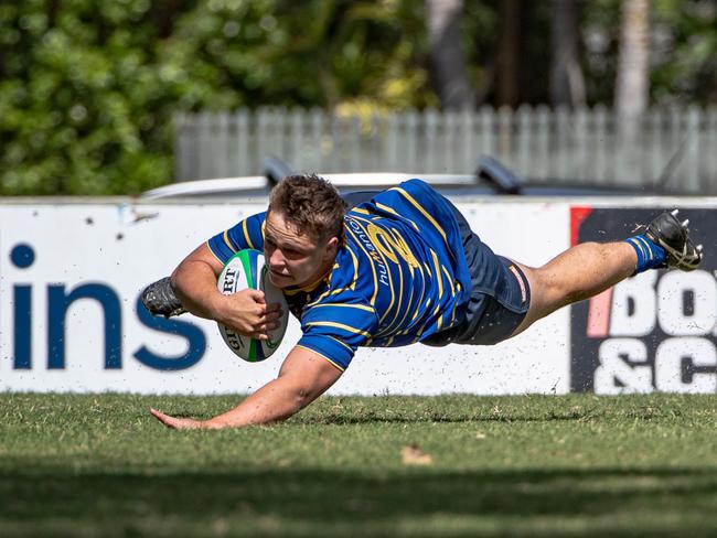 Zac Crothers diving over to score.