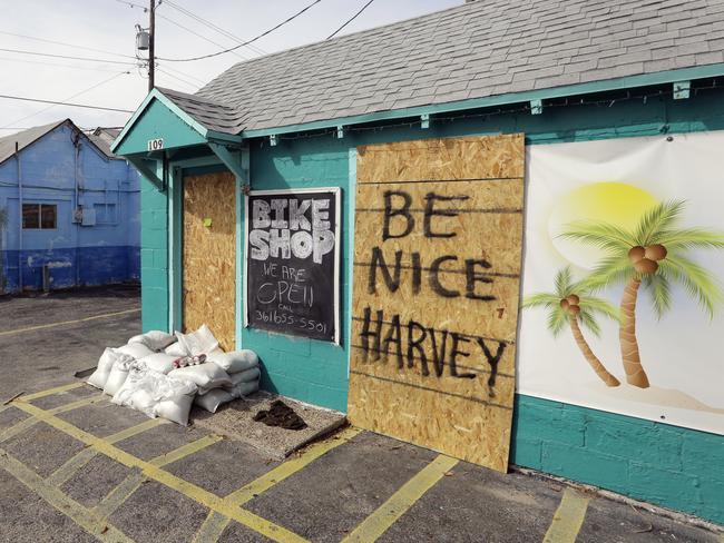 A shuttered local business has a sign for Hurricane Harvey. Picture: AP Photo/Eric Gay