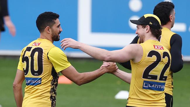 Teammate Jacob Hopper welcomes Marlion Pickett on the track. Picture: Michael Klein