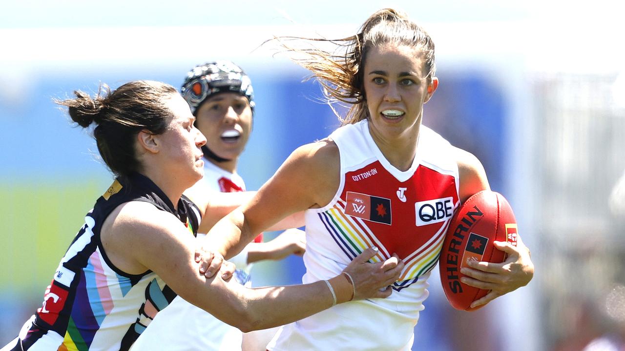 Sydney's Chloe Molloy fends off Collingwood's Sophie Casey during the AFLW Pride Round match between the Sydney Swans and Collingwood at Henson Park on October 29, 2023. Photo by Phil Hillyard (Image Supplied for Editorial Use only - **NO ON SALES** - Â©Phil Hillyard )