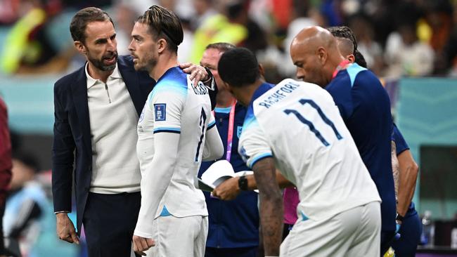 England's coach Gareth Southgate gives instructions to England's forward #07 Jack Grealish