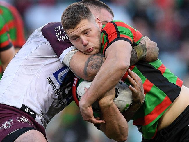 Bayley Sironen of the Rabbitohs is tackled by Curtis Sironen of the Sea Eagles during the Round 17 NRL match between the South Sydney Rabbitohs and the Manly Sea Eagles at ANZ Stadium in Sydney, Saturday, July 13, 2019. (AAP Image/Dan Himbrechts) NO ARCHIVING, EDITORIAL USE ONLY