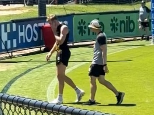 Tom Lynch stumbles off at Richmond training. Picture: Matthew Forrest/Video