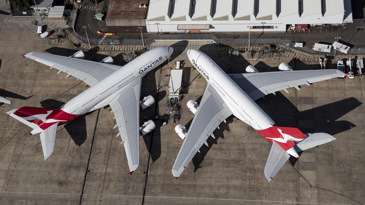 Qantas jets parked at Sydney Airport. The airline is embroiled in a debate over access to slots at Australia’s biggest gateway. Picture: Getty Images