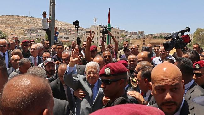 Palestinian president Mahmud Abbas arrives to lay a wreath of flowers in Jenin.