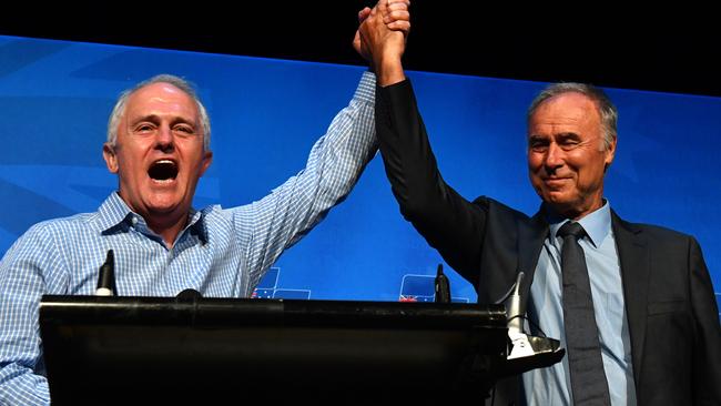 Malcolm Turnbull and John Alexander celebrate winning the Bennelong by-election. Picture: AAP Image/Mick Tsikas