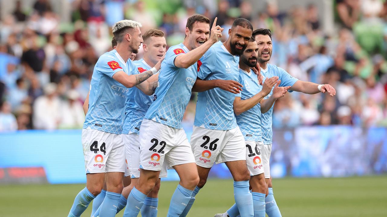 MELBOURNE, AUSTRALIA – DECEMBER 28: Curtis Good of Melbourne City celebrates scoring a goal with team mates during the A-League Men round 10 match between Melbourne City and Brisbane Roar at AAMI Park, on December 28, 2023, in Melbourne, Australia. (Photo by Kelly Defina/Getty Images)