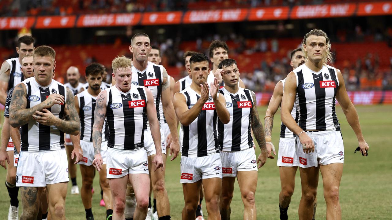 Collingwood's Nick Daicos and Darcy Moore leave the field. Phil Hillyard.