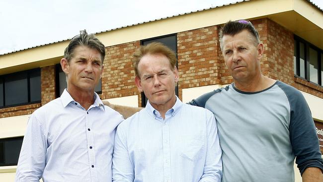 Paul, Ricki and Stephen Grimmer outside the Fairy Meadow Surf Life Saving Club, near where their sister disappeared 46 years ago. Picture: John Appleyard