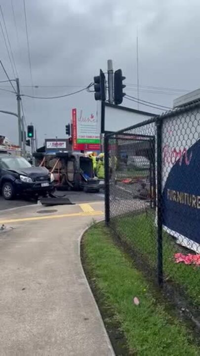 One trapped as car flips in CBD