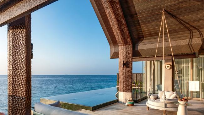 Relax in blissful comfort on your private sundeck in a pool villa.