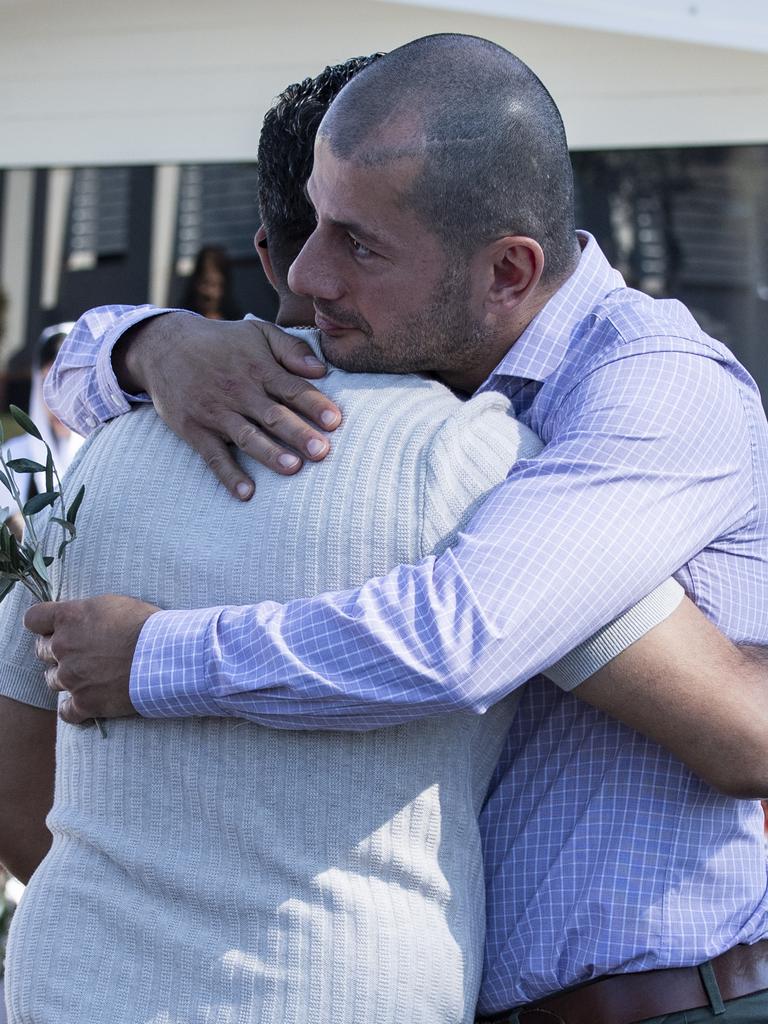 Two members of the church community console each other at the Sunday Morning Mass at The Good Shepherd Church, Wakeley. Picture: Monique Harmer