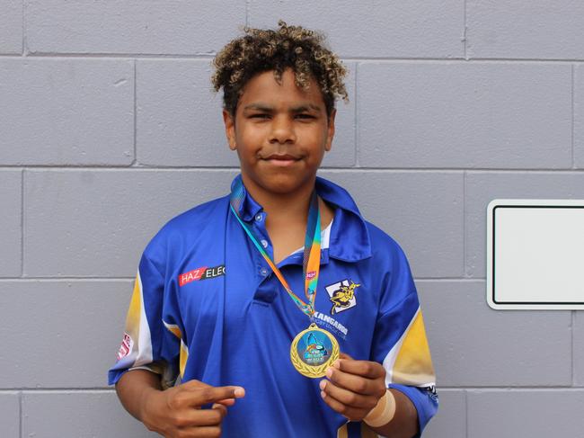 Jairae Tabuai of the Kangaroos with his premiership medal after winning the Far North Queensland Rugby League under 14s grand final against Innisfail Leprechauns at Barlow Park. Jake Garland