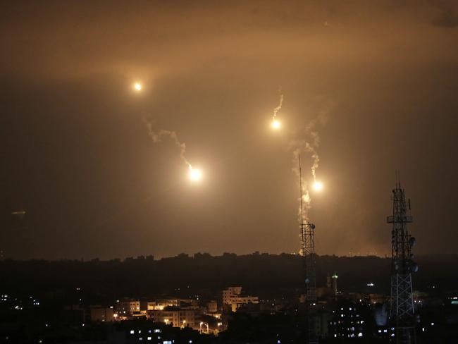 Israeli forces flares light up the night sky in the east of Gaza City yesterday.. Picture: Khalil Hamra