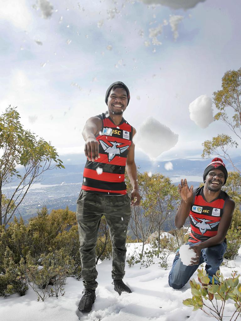 <p>Aboriginal players from Darwin, Henry Kerinaiua, left, and Timothy Mosquito in 2018 having nearly finished their season, helping Tasmanian side Lauderdale into the finals. Snow on kunanyi/Mount Wellington is a far cry from the climate in their Northern Territory home Picture: MATHEW FARRELL</p>