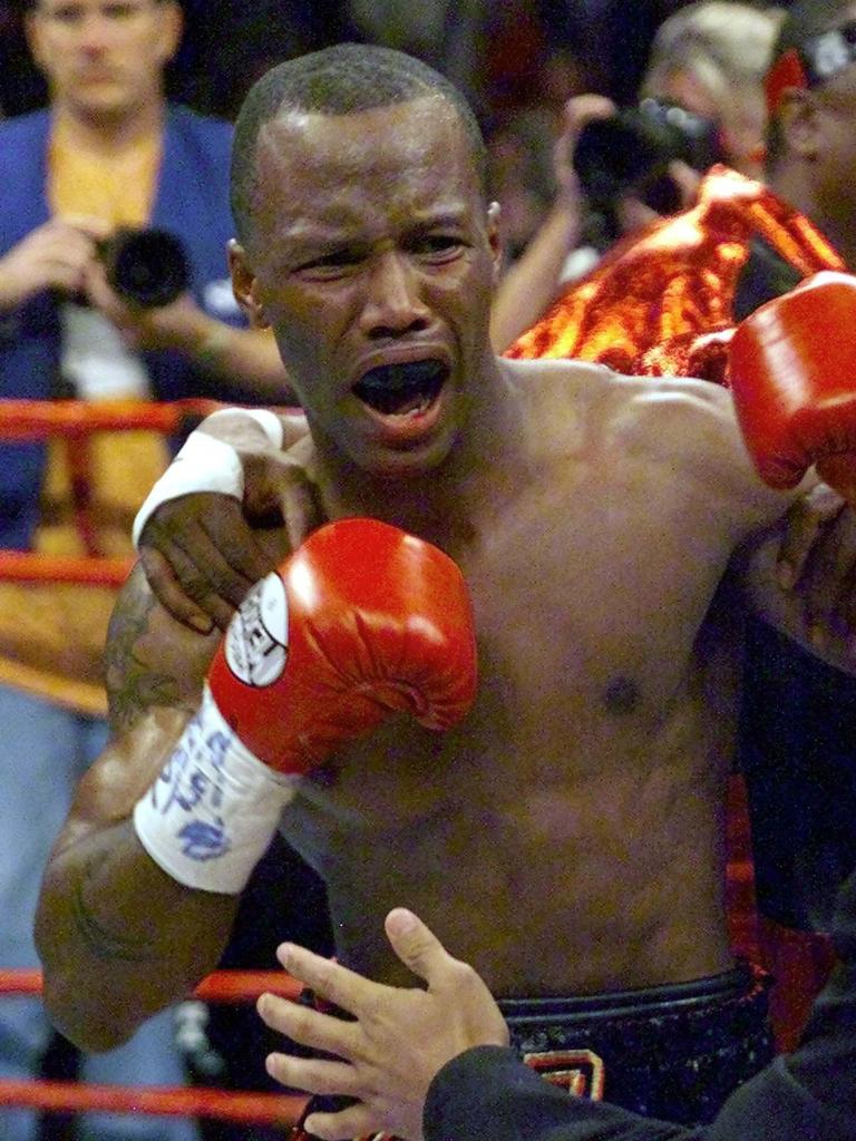 Zab Judah is restrained as he tries to rush referee Jay Nady after Nady stopped the fight against Kostya Tszyu. Picture: AP