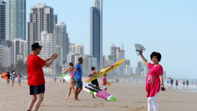 Loving Australia ... Chinese Tourists pictured on Broadbeach. Picture Mike Batterham