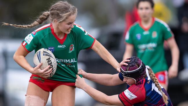 Corrimal’s Zali Yeo hands off a Collegians defender. News Local, Pictures by Julian Andrews.